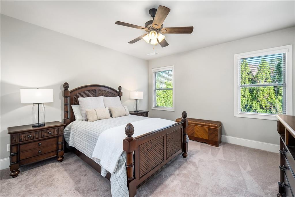 6660 Tulip Plantation Road Alpharetta, GA 30004 - Photo 23 of 68 a bedroom with a bed and a window
