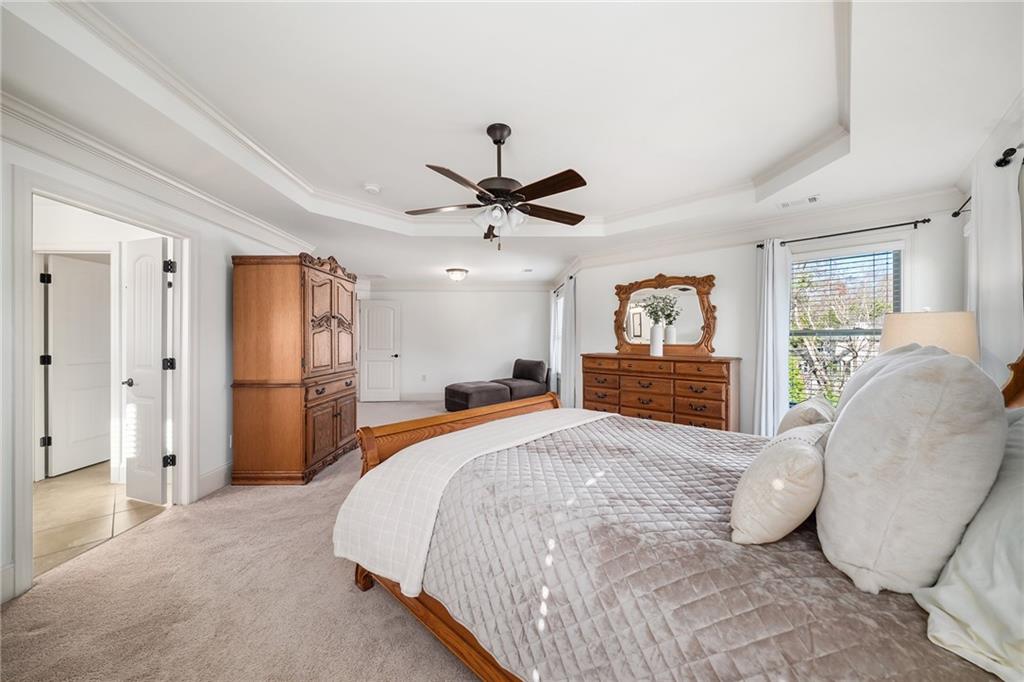 6660 Tulip Plantation Road Alpharetta, GA 30004 - Photo 27 of 68 a bed room with a bed and a chair