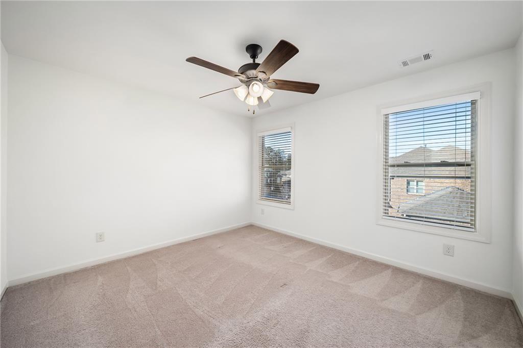 6660 Tulip Plantation Road Alpharetta, GA 30004 - Photo 34 of 68 a view of an empty room with a window