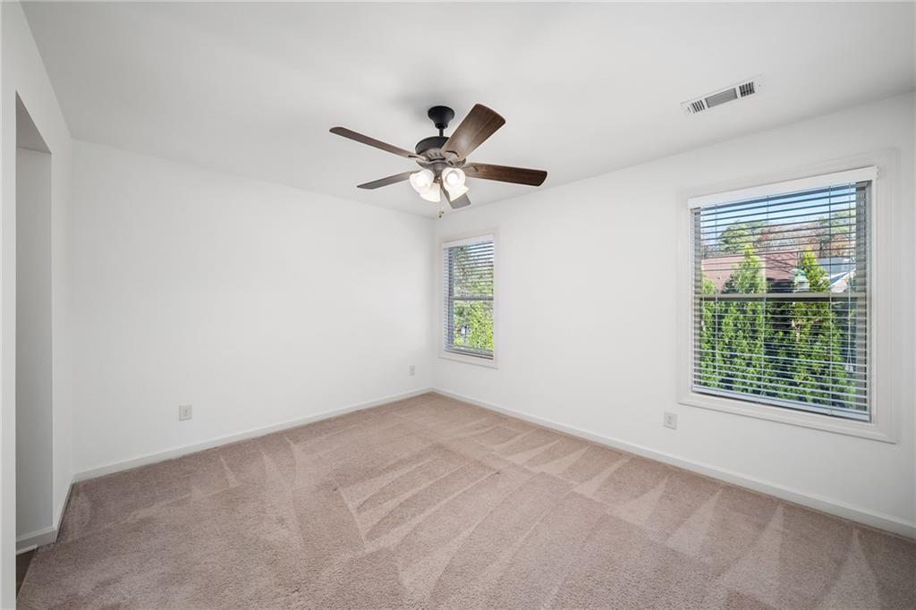 6660 Tulip Plantation Road Alpharetta, GA 30004 - Photo 37 of 68 a view of an empty room with a window