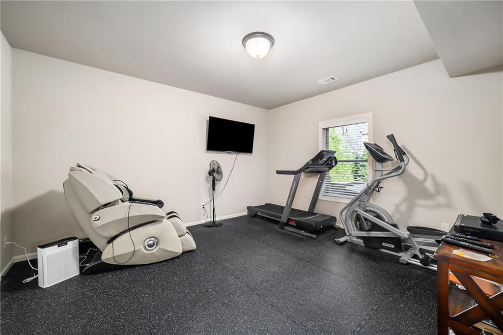 6660 Tulip Plantation Road Alpharetta, GA 30004 - Photo 44 of 68 a room with gym equipment