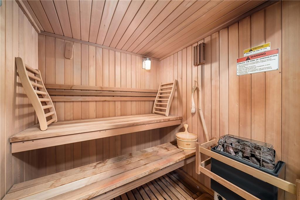 6660 Tulip Plantation Road Alpharetta, GA 30004 - Photo 46 of 68 a kitchen with wooden cabinets and a stove