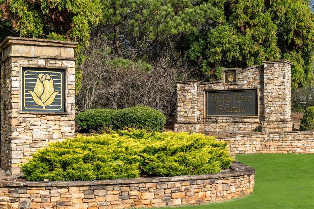6660 Tulip Plantation Road Alpharetta, GA 30004 - Photo 55 of 68 a front view of a house with a yard