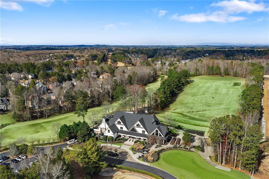 6660 Tulip Plantation Road Alpharetta, GA 30004 - Photo 56 of 68 a view of a lake with a yard