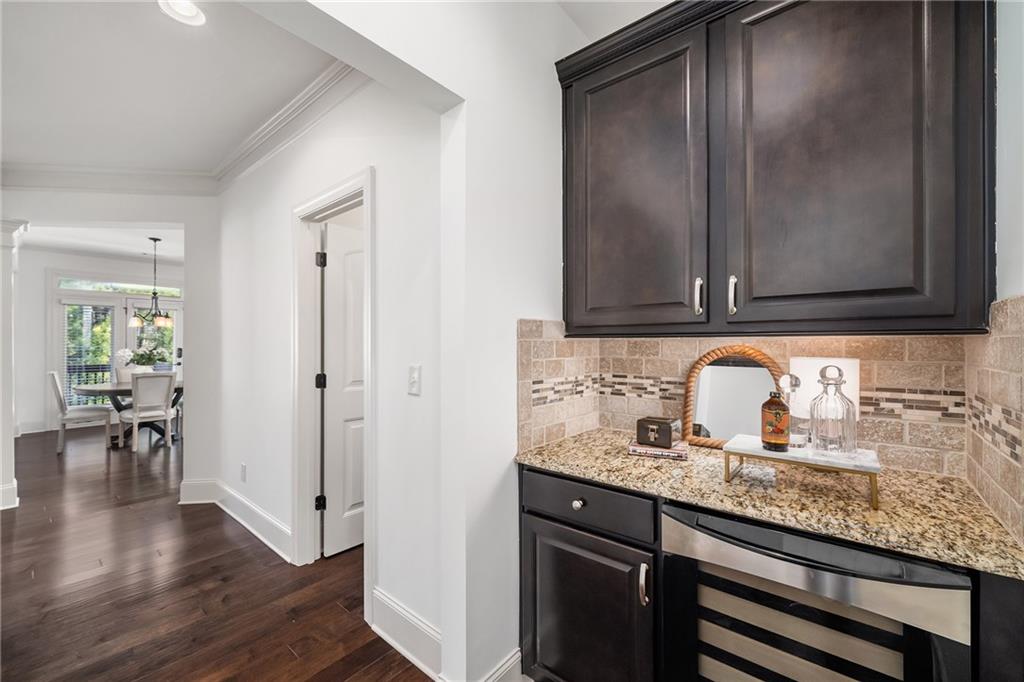 6660 Tulip Plantation Road Alpharetta, GA 30004 - Photo 7 of 68 a kitchen with granite countertop stainless steel appliances a sink and cabinets