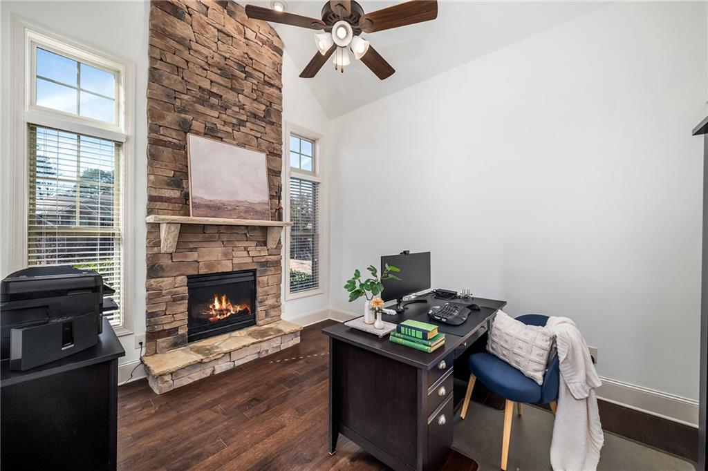 6660 Tulip Plantation Road Alpharetta, GA 30004 - Photo 8 of 68 a living room with furniture and a fireplace