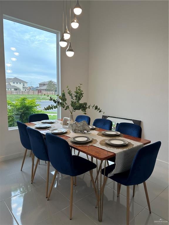 1912 East Ridgeway Circle Edinburg, TX 78542 - Photo 12 of 16 a view of a dining room with furniture window and wooden floor