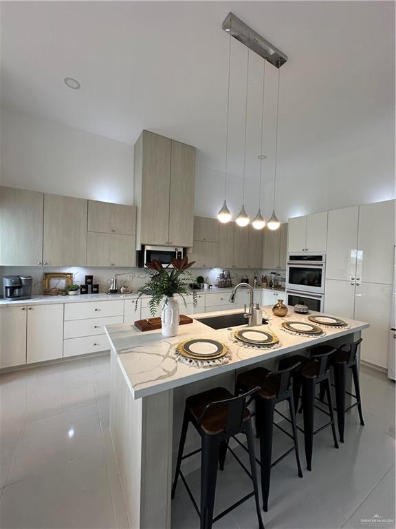 1912 East Ridgeway Circle Edinburg, TX 78542 - Photo 13 of 16 a kitchen with a sink and chairs
