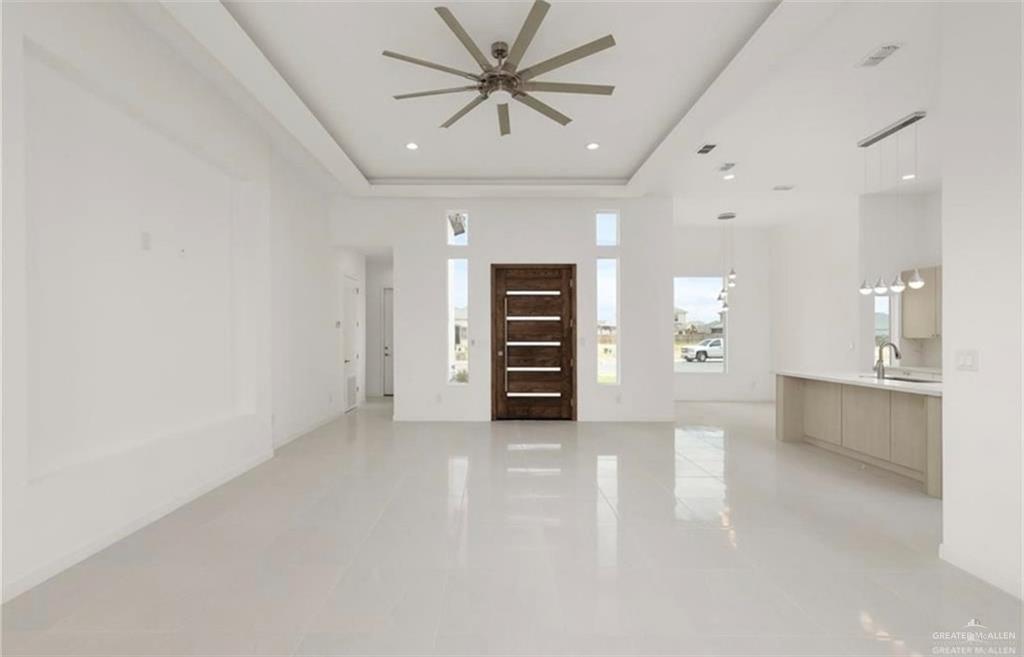 1912 East Ridgeway Circle Edinburg, TX 78542 - Photo 2 of 10 wooden floor in an empty room with a window