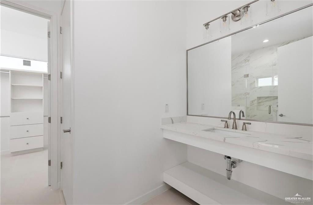1912 East Ridgeway Circle Edinburg, TX 78542 - Photo 8 of 10 a bathroom with a sink and a mirror