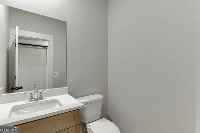 a view of a house with a yard and garage