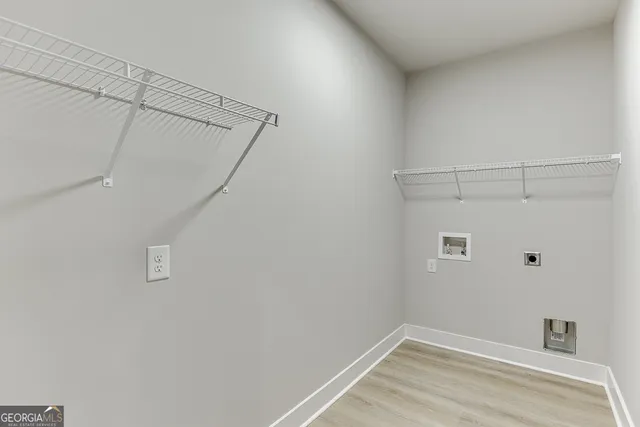 an aerial view of a house with garden space and sitting area