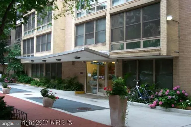 a view of a building with sitting area