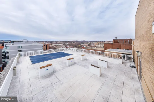 a view of a building with sitting area