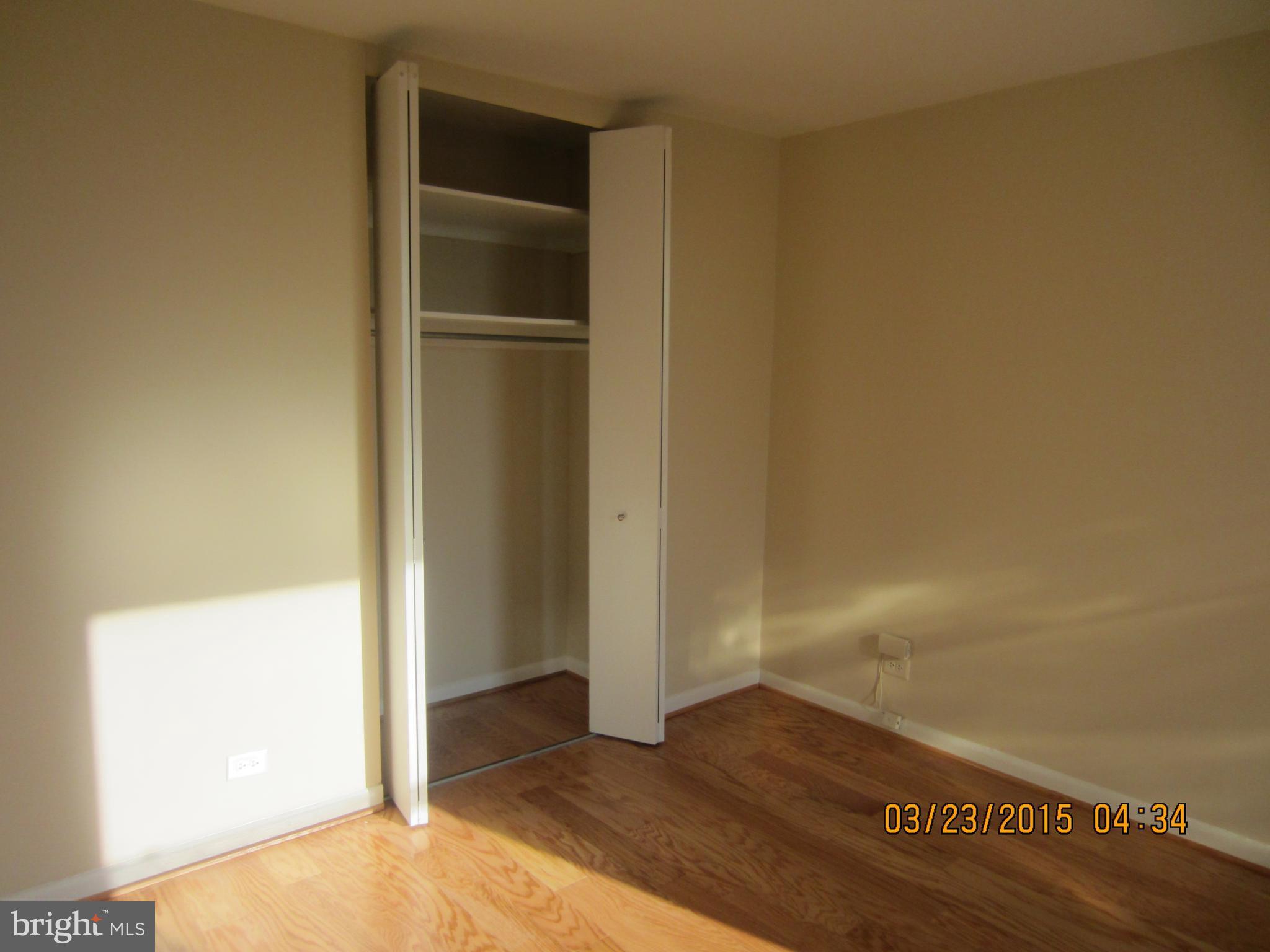 1260 21st Street Northwest, Unit 1004 Washington, DC 20036 - Photo 6 of 8 a view of empty room with wooden floor
