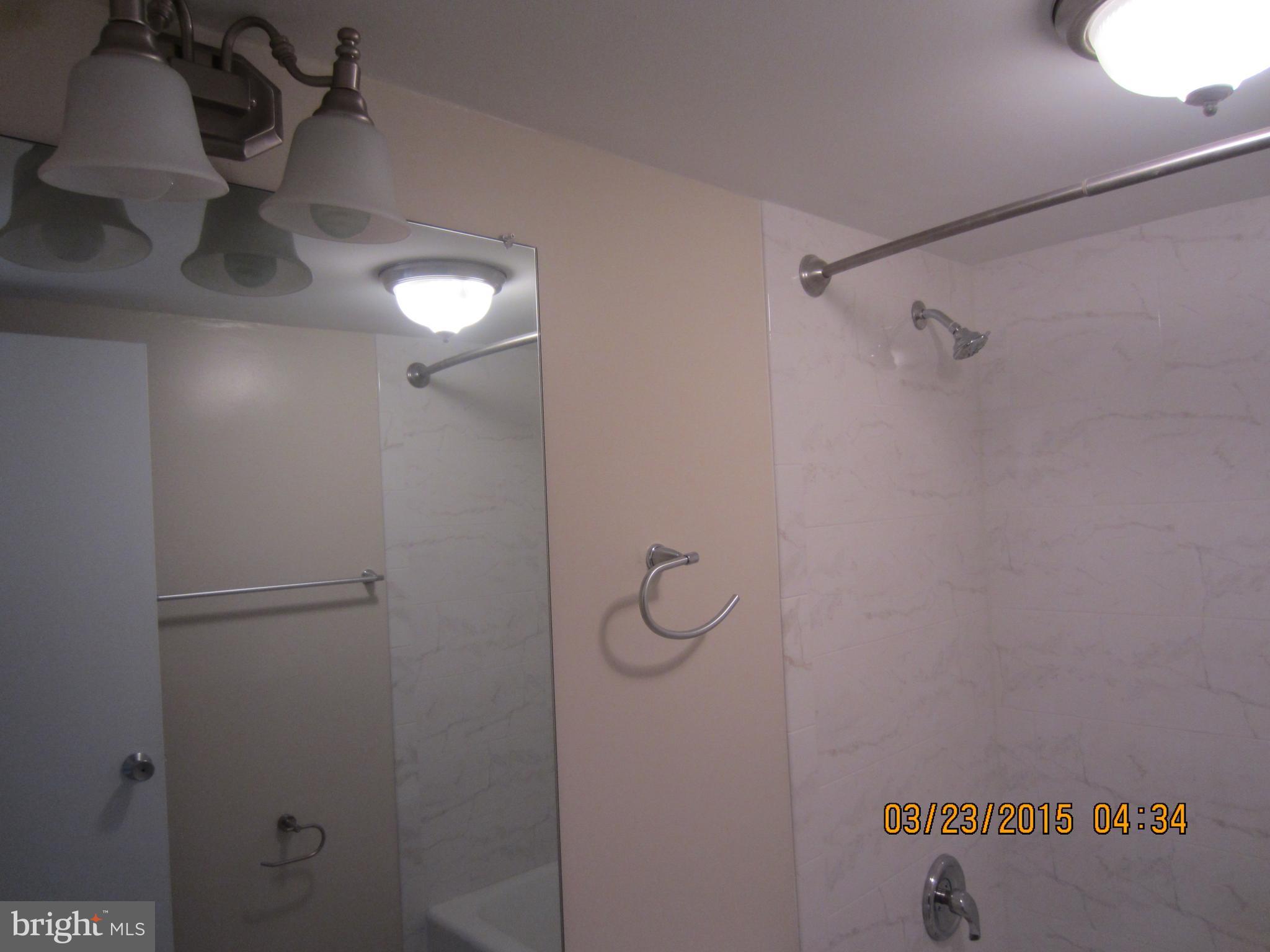 1260 21st Street Northwest, Unit 1004 Washington, DC 20036 - Photo 7 of 8 a bathroom with a shower