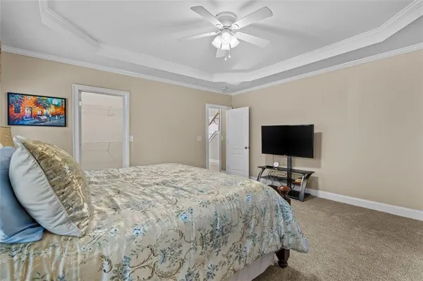 a view of walk in closet with clothes