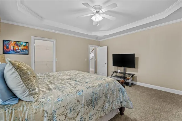 a view of walk in closet with clothes