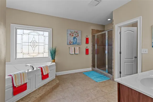 a bedroom with a bed and with furniture