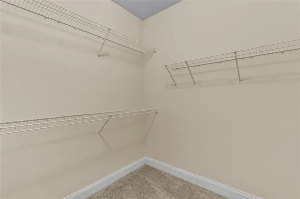 a white toilet sitting next to a bathroom sink