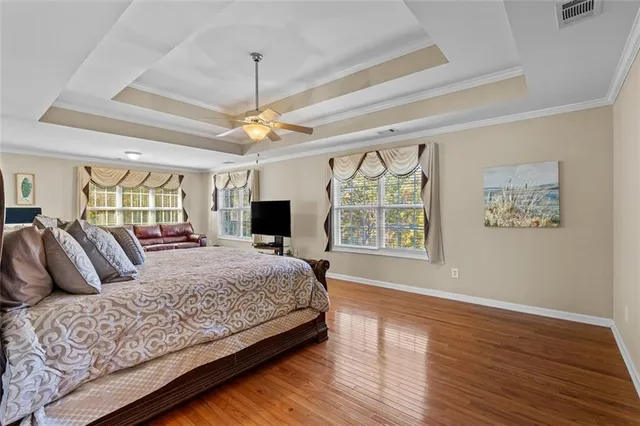 a bedroom with a bed and a table