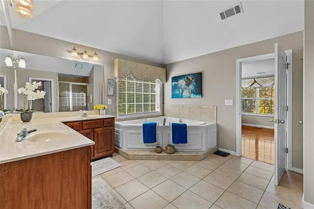 a living room with furniture and pool table