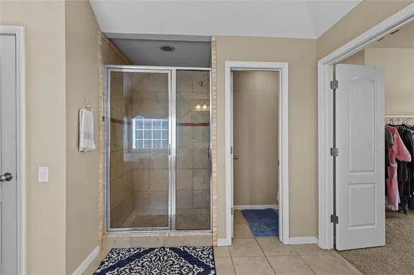 a living room with furniture pool table and flat screen tv