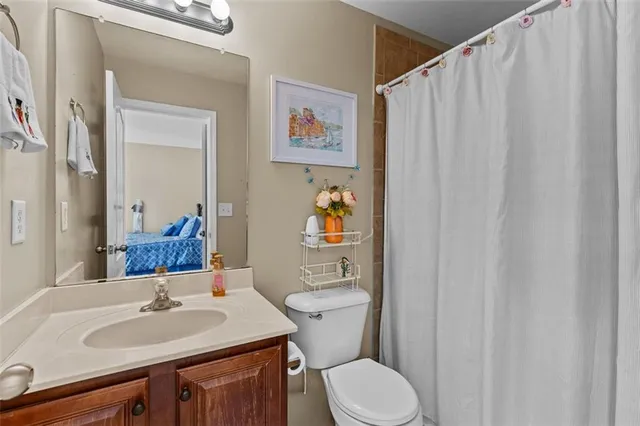a view of a patio with table and chairs and floor to ceiling window