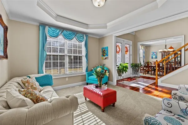 a living room with fireplace furniture and a flat screen tv
