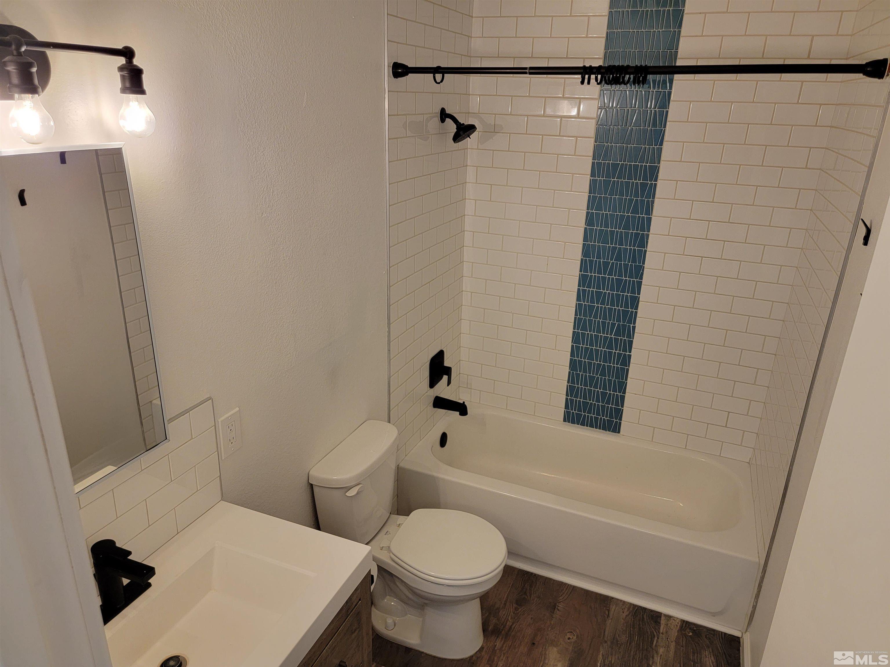 1101 East Taylor Street Reno, NV 89502 - Photo 11 of 17 a bathroom with a toilet and a shower