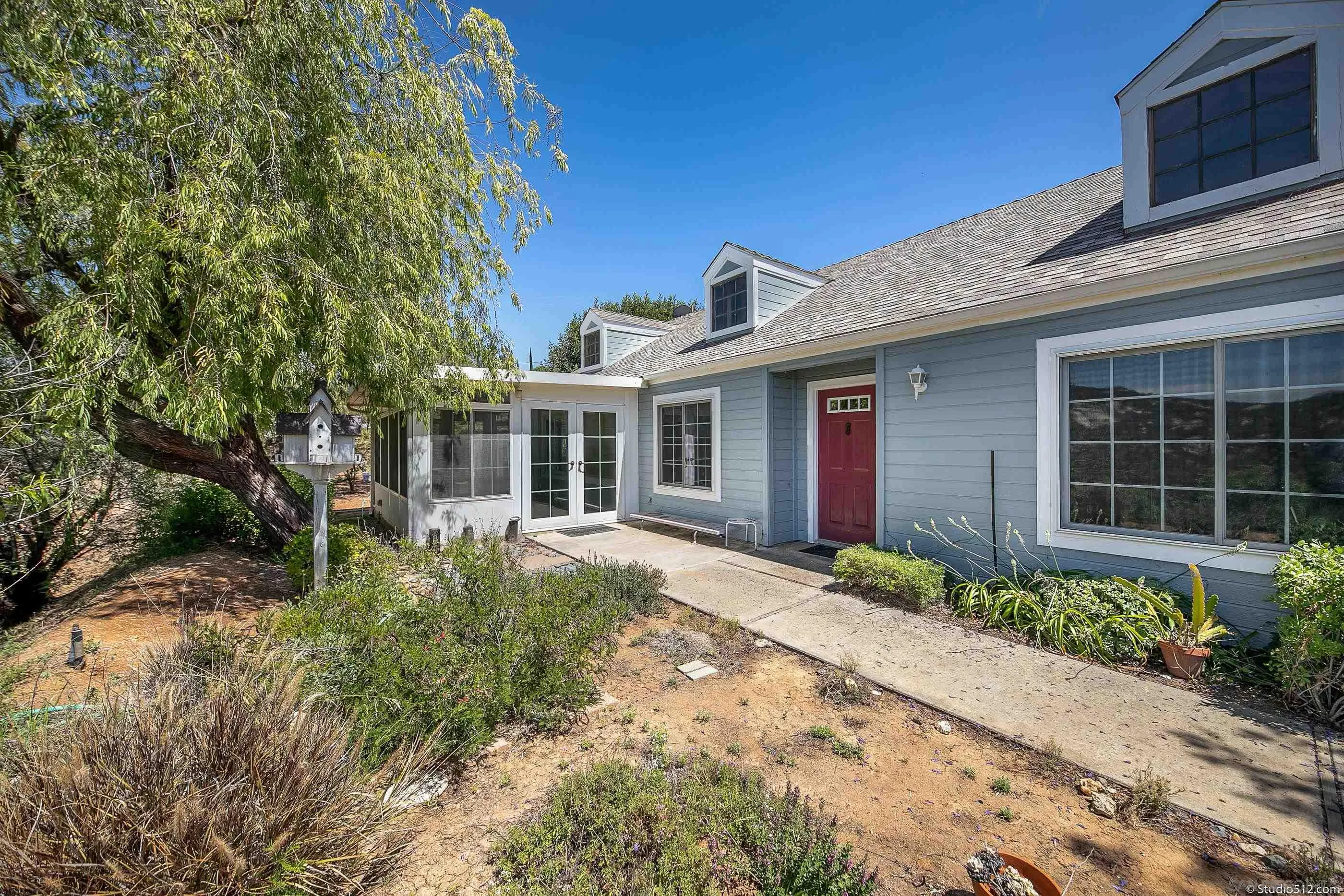 30371 The Yellow Brick Road Valley Center, CA 92082 - Photo 1 of 31 a front view of a house with garden
