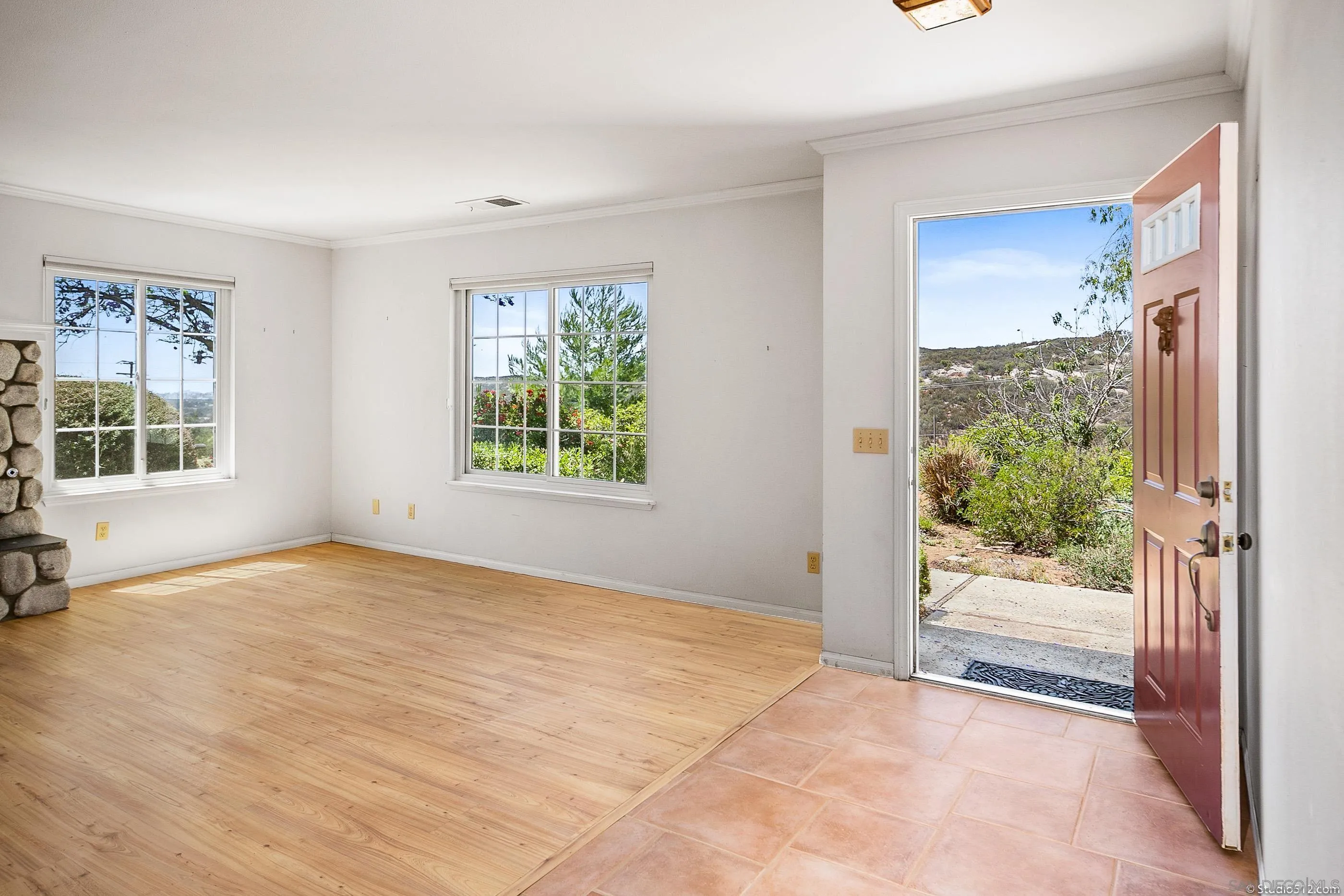 30371 The Yellow Brick Road Valley Center, CA 92082 - Photo 5 of 31 a view of an empty room with wooden floor and a window
