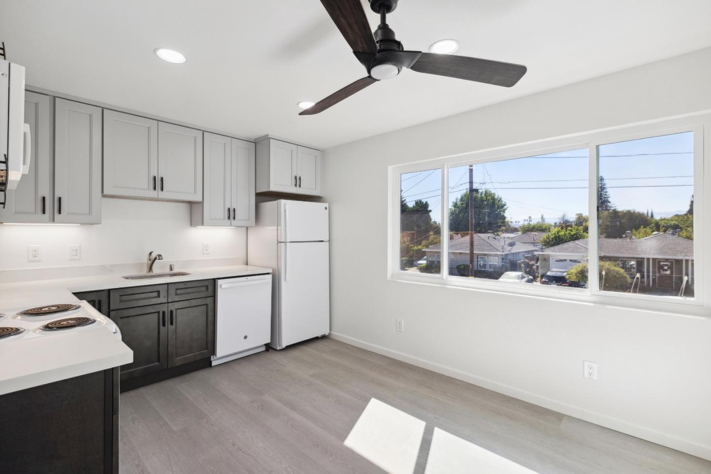 617 Bryan Avenue Sunnyvale, CA 94086 - Photo 7 of 16 a kitchen with a stove a sink and a refrigerator