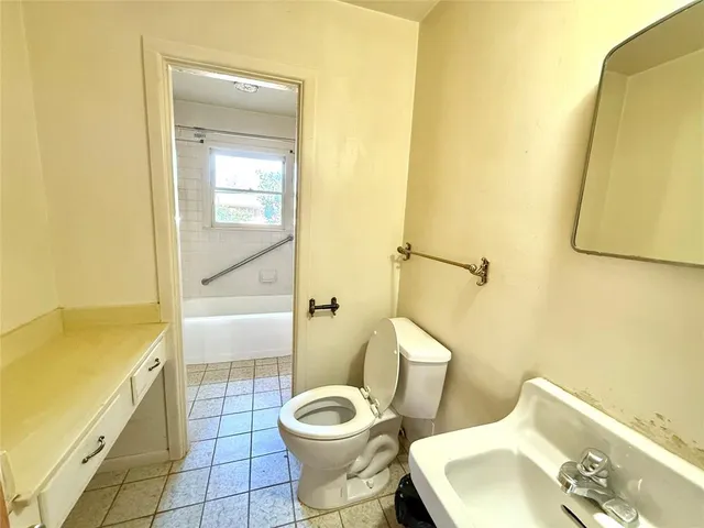 a bathroom with a toilet and a sink