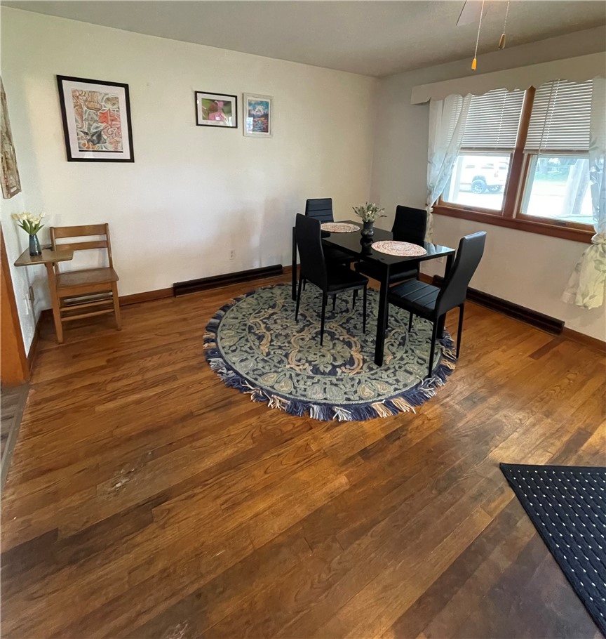 360 Ridge Street Piqua, OH 45356 - Photo 6 of 46 This inviting dining area features elegant hardwood flooring, perfect for gatherings and everyday meals.