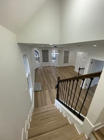 a bathroom with a double vanity sink toilet and shower