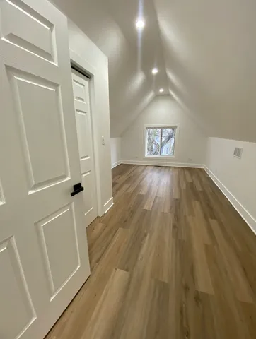 a bathroom with a sink a toilet a mirror and shower