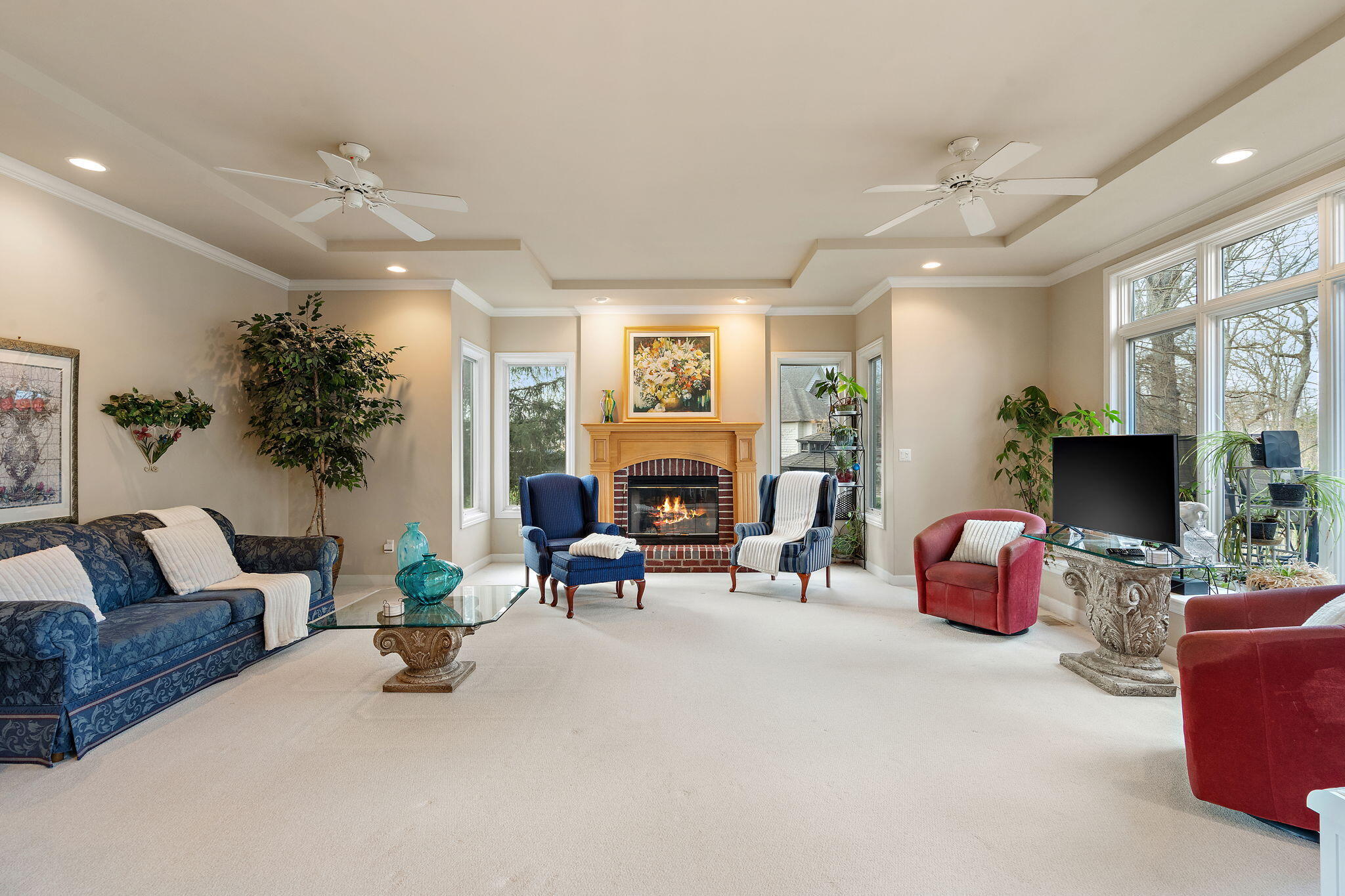 7412 Forest Ridge Drive Schererville, IN 46375 - Photo 12 of 60 a living room with furniture toys and a fireplace
