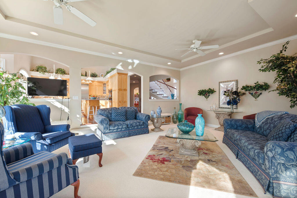 7412 Forest Ridge Drive Schererville, IN 46375 - Photo 16 of 63 a living room with furniture fireplace and a chandelier