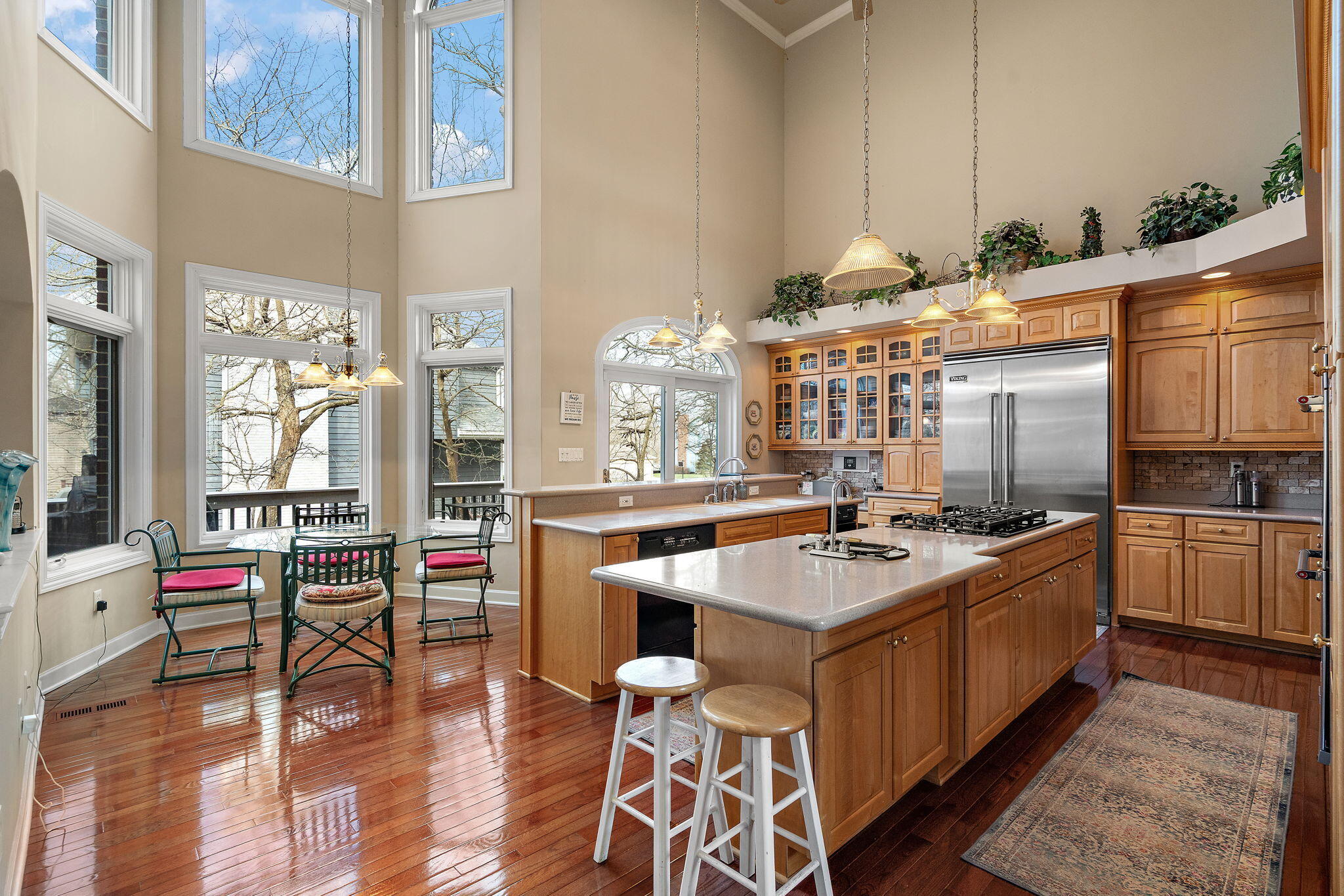 7412 Forest Ridge Drive Schererville, IN 46375 - Photo 20 of 60 a kitchen with stainless steel appliances granite countertop a stove and cabinets