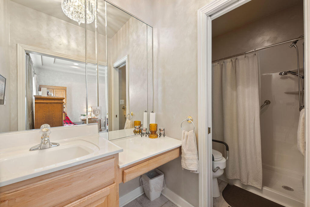 7412 Forest Ridge Drive Schererville, IN 46375 - Photo 36 of 60 a bathroom with a double vanity sink mirror and shower