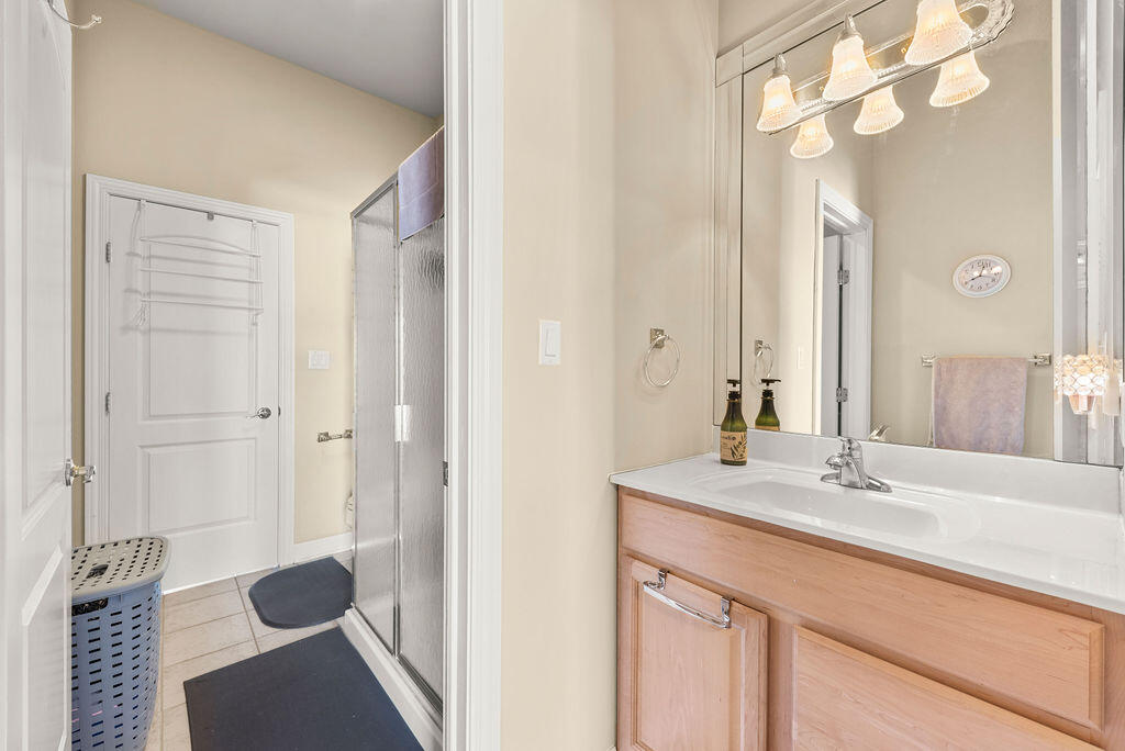 7412 Forest Ridge Drive Schererville, IN 46375 - Photo 37 of 60 a bathroom with a sink and a mirror