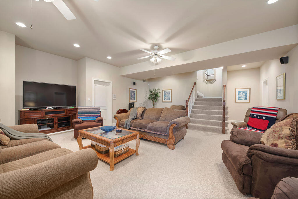 7412 Forest Ridge Drive Schererville, IN 46375 - Photo 41 of 60 a living room with furniture and a flat screen tv