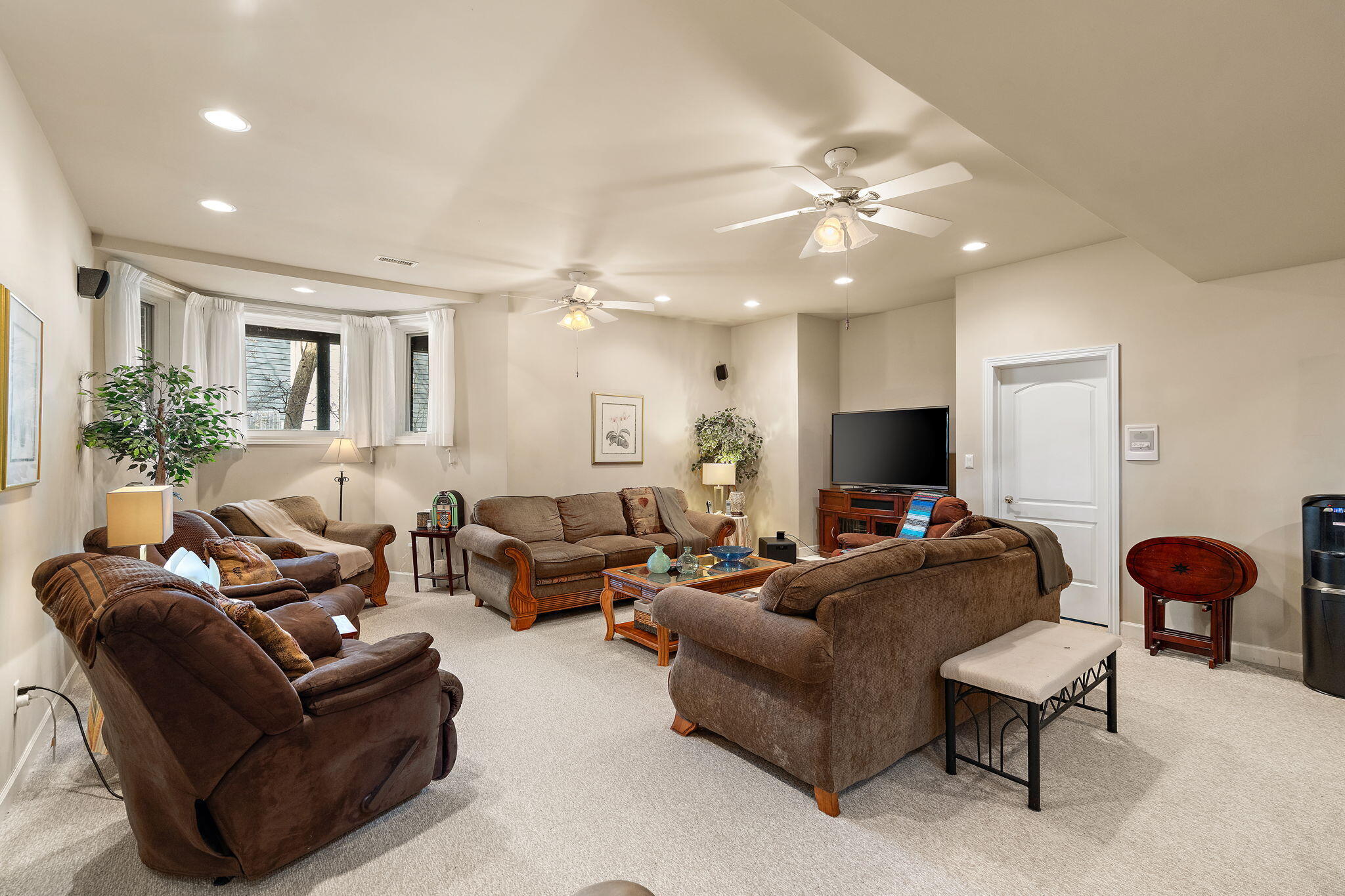 7412 Forest Ridge Drive Schererville, IN 46375 - Photo 42 of 60 a living room with furniture and a flat screen tv