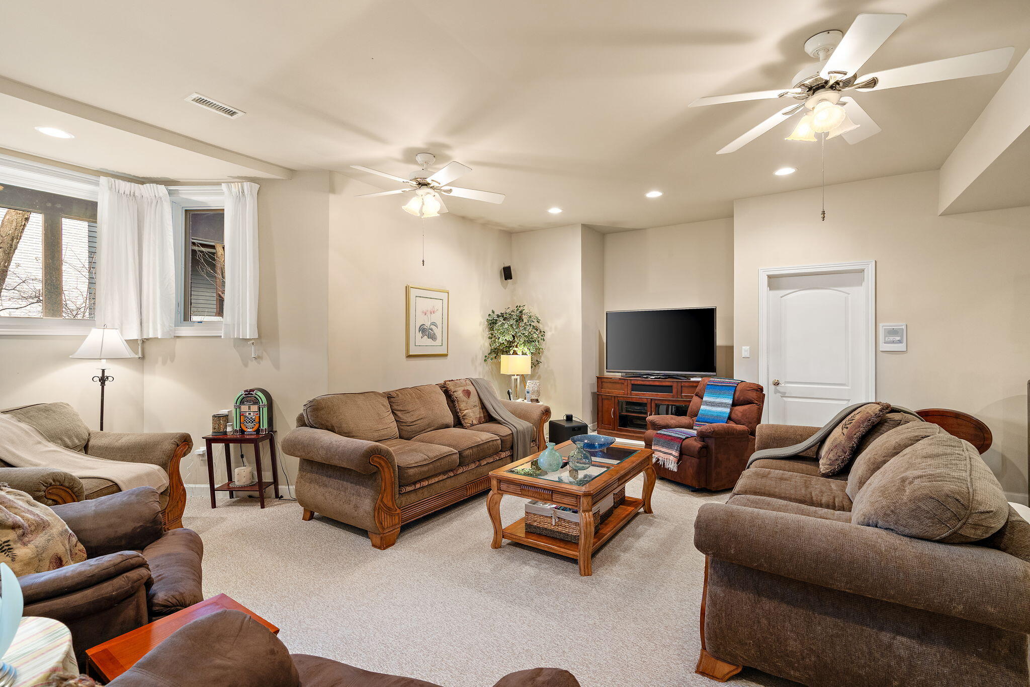 7412 Forest Ridge Drive Schererville, IN 46375 - Photo 46 of 60 a living room with furniture and a flat screen tv