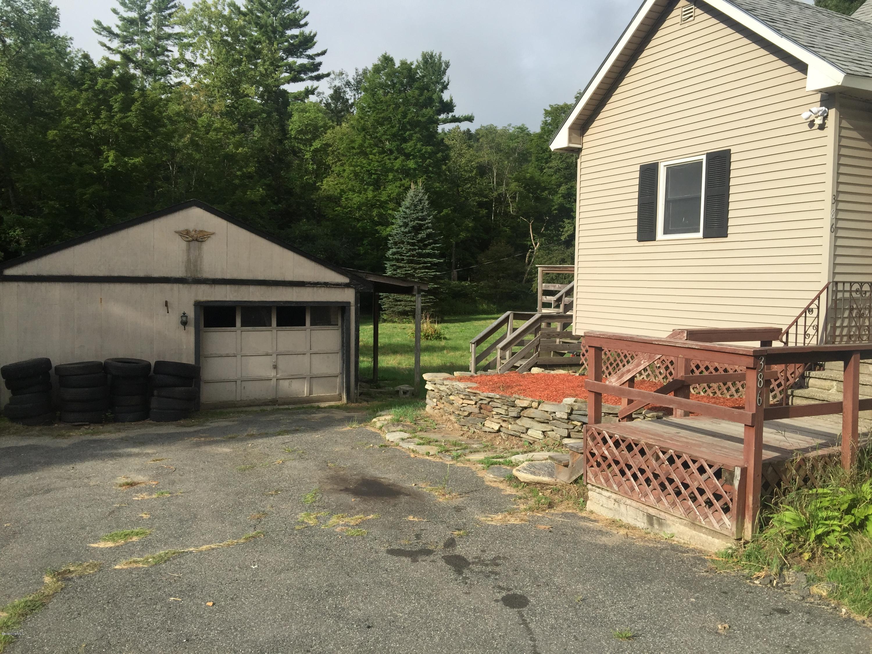 386 South Washington State Road Washington, MA 01223 - Photo 2 of 15 a front view of a house with garden
