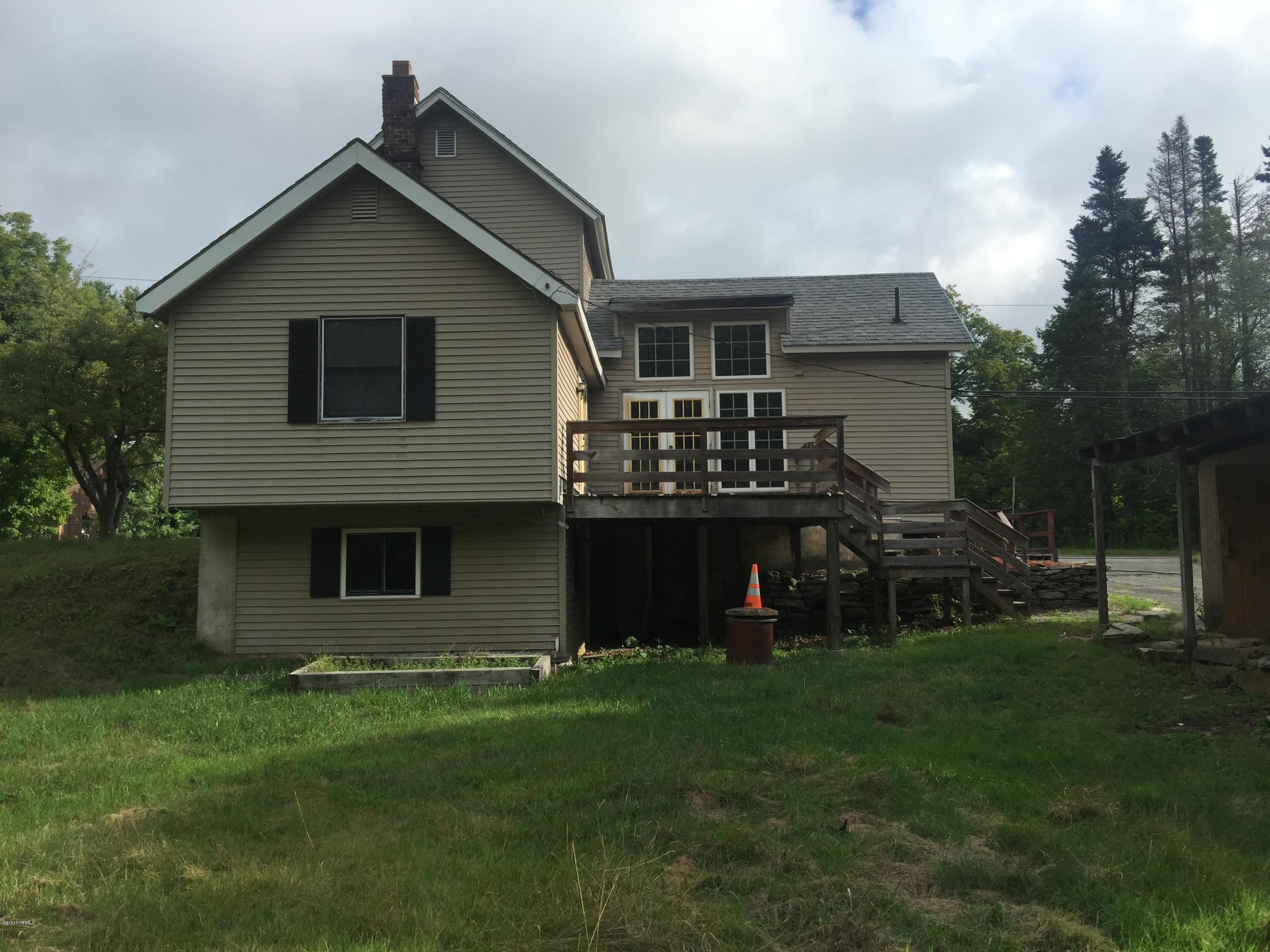 386 South Washington State Road Washington, MA 01223 - Photo 3 of 15 a front view of a house with a garden