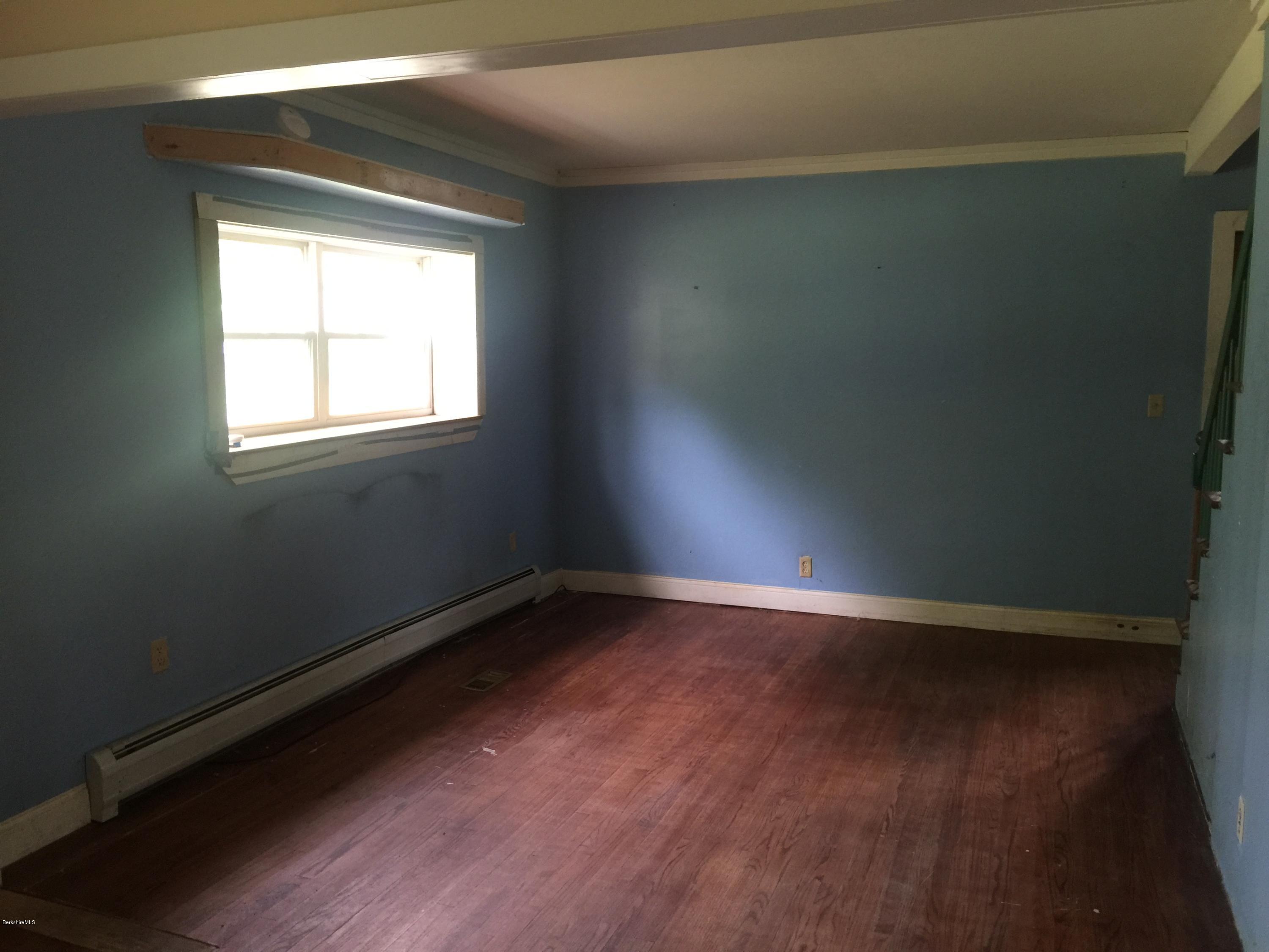 386 South Washington State Road Washington, MA 01223 - Photo 7 of 15 an empty room with wooden floor and windows