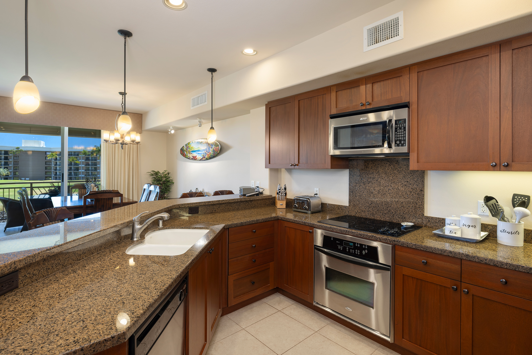69-1033 Nawahine Place, Unit 4G Waikoloa, HI 96738 - Photo 11 of 26 a kitchen with a sink stove and microwave
