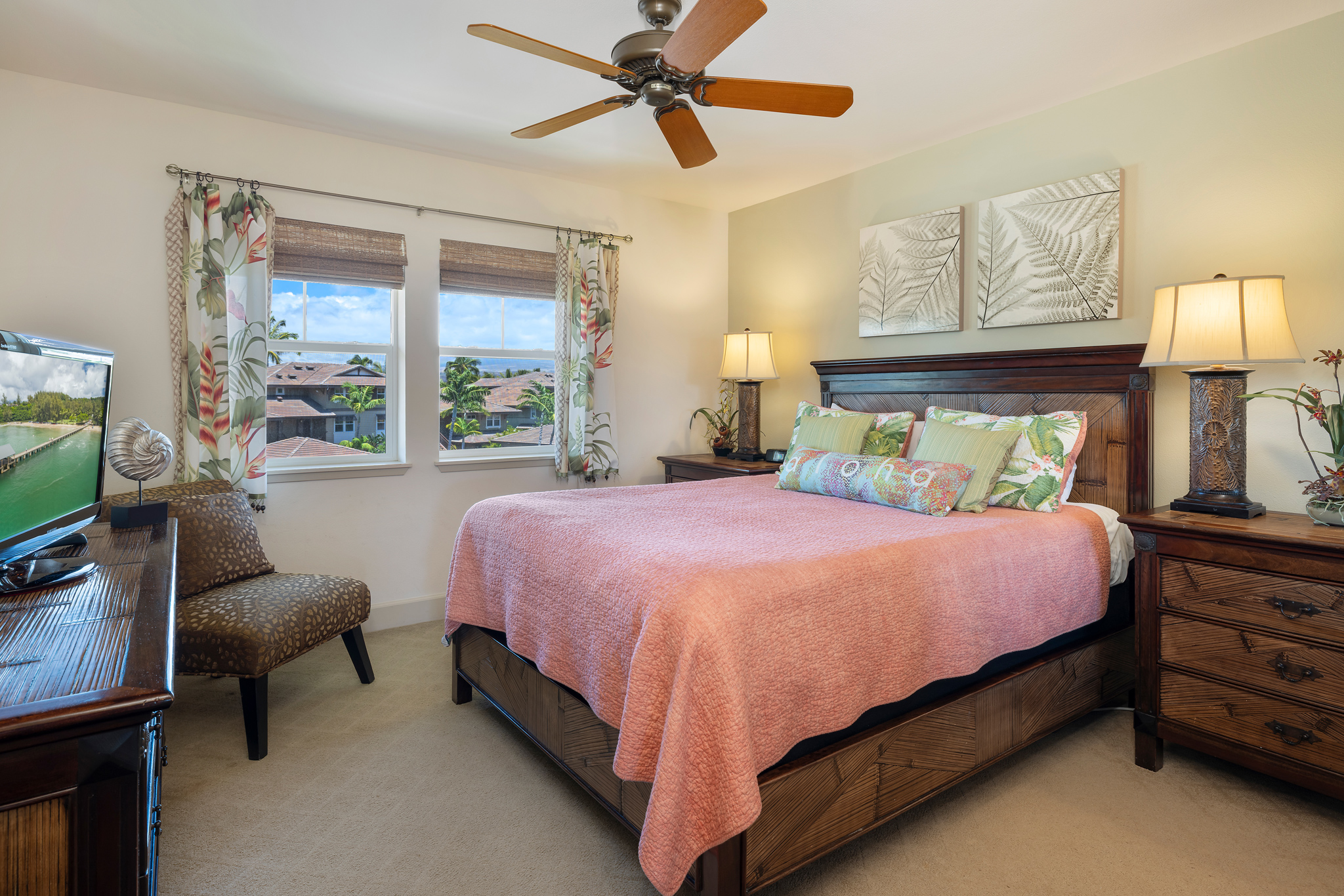 69-1033 Nawahine Place, Unit 4G Waikoloa, HI 96738 - Photo 13 of 26 a spacious bedroom with a bed and a chandelier